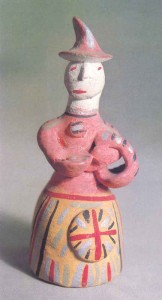 Figurine of a peasant woman with a basket in baked