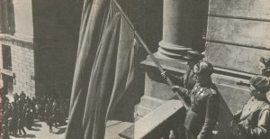 The raising of the red banner on the balcony of the Opera House
