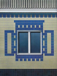 Fragment of facade panel houses, lined with ceramic tiles.