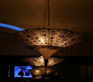 Two cone-shaped lamps in the Chinese style make the setting in a cafe a more private and intimate.