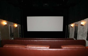 A small cinema with expensive leather chairs.