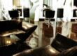 The combination of black and white. Large pictures on the walls. Special furniture for beauty salon.
