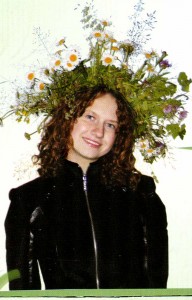 The Nizhny Novgorod region. Lake Svetloyar. Girl in a wreath of wildflowers.