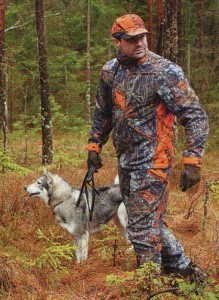 Hunting with a dog in the woods.