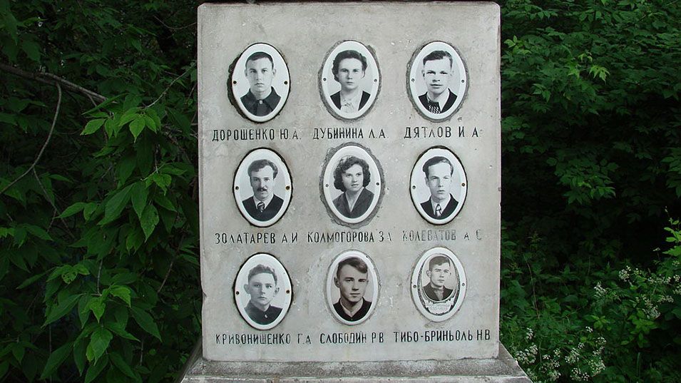 Photos of members of the tour group at their monument.