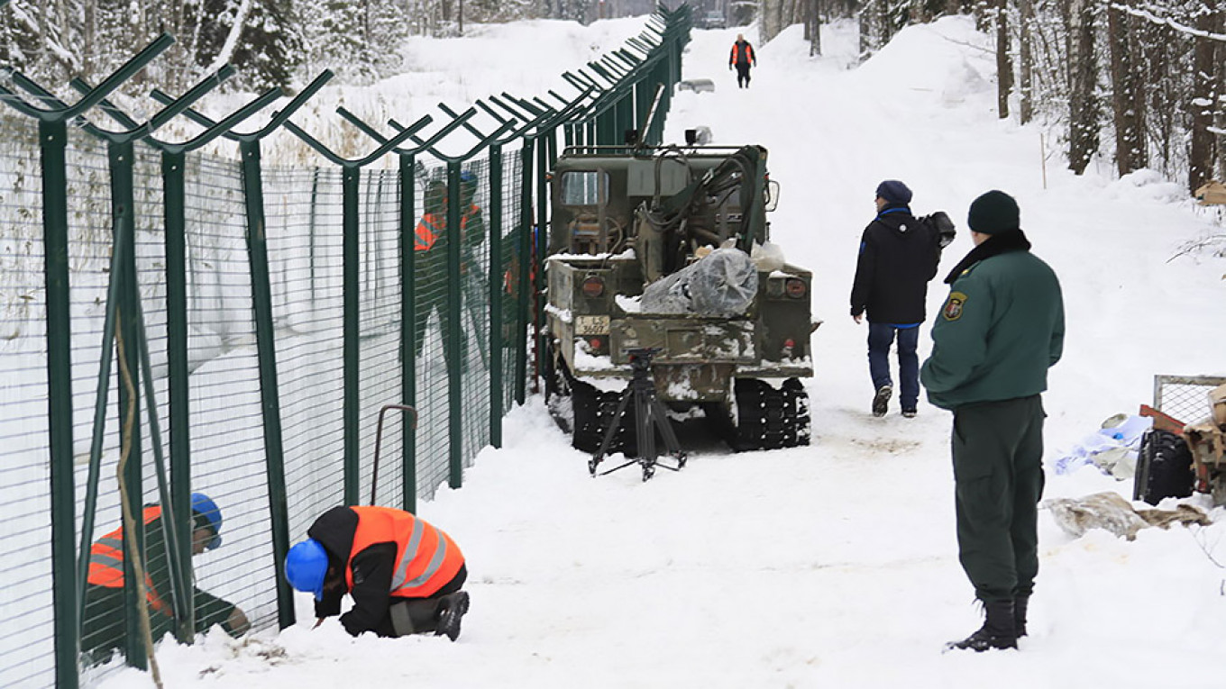 Latvia Builds Barbed Wire Fence on Russian Border to Combat Migration