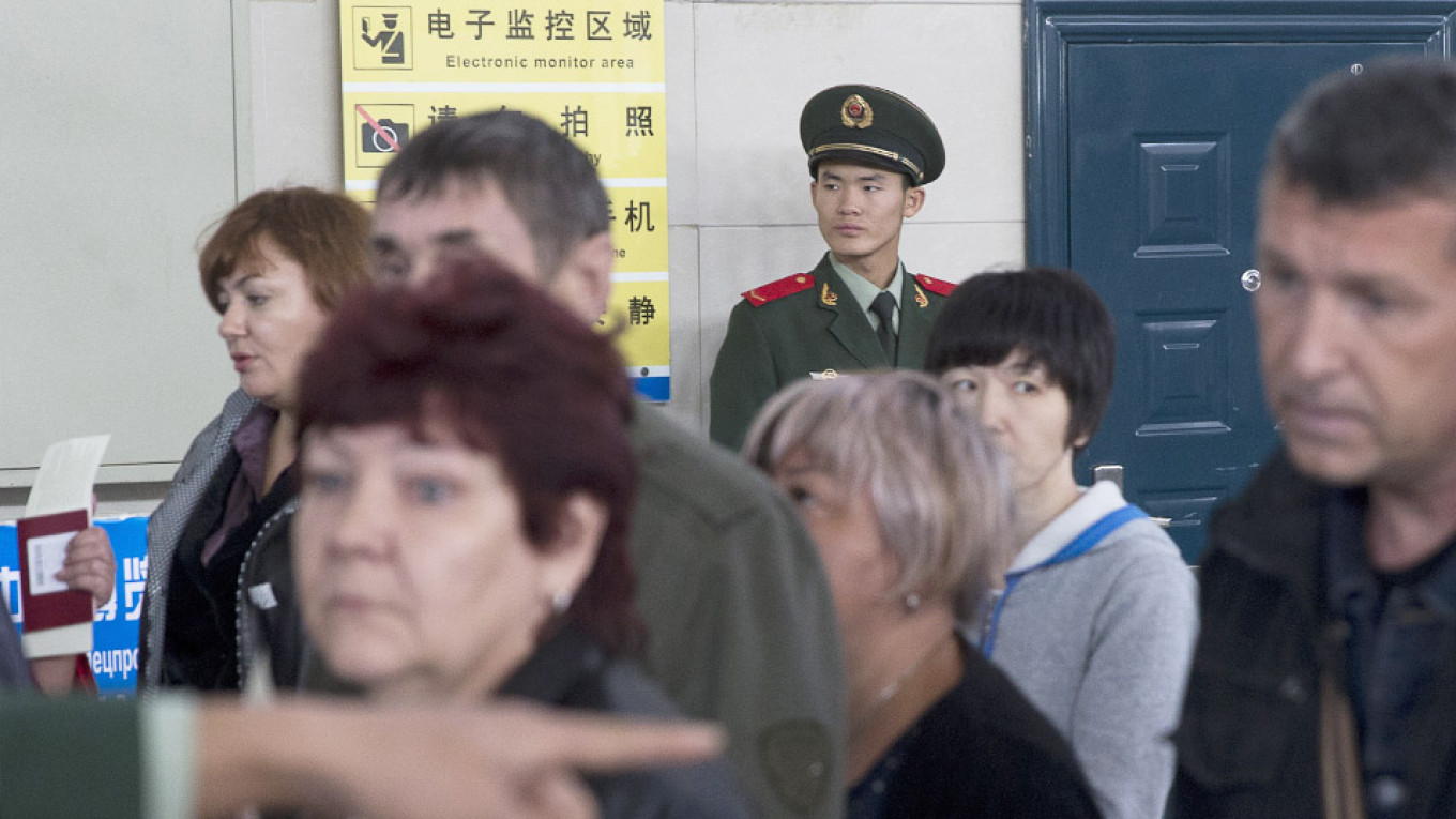 Chinese Officials Are Searching Russian Travelers’ Phones at Border, Consulate Warns