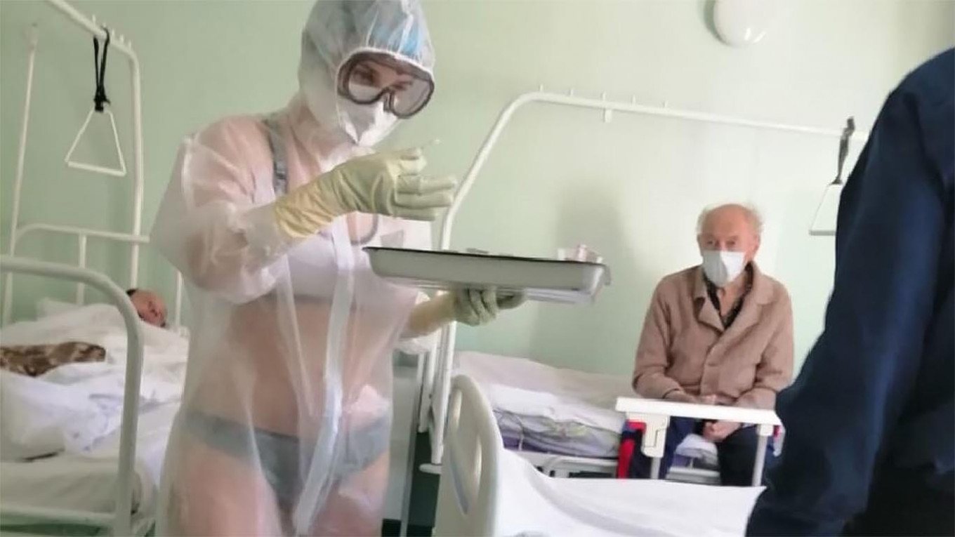 Russian Coronavirus Nurse Scolded for Wearing Bikini Under See-Through Gown