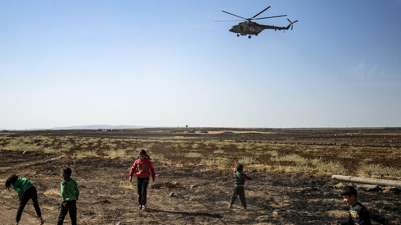 Russian Military Attempts to Disperse Syria Protesters With Helicopter Fly-Over