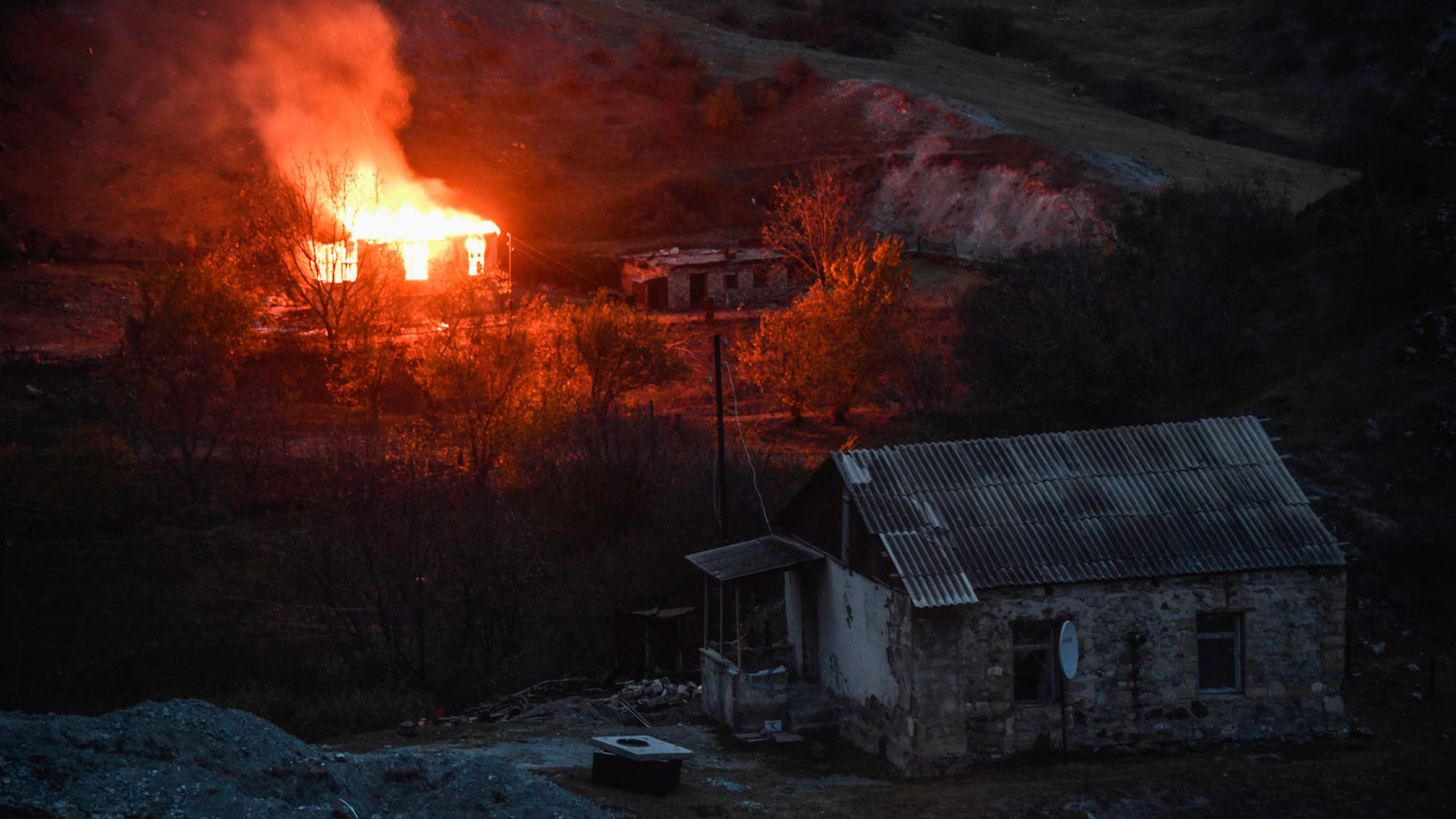 In Photos: Armenians in Nagorno-Karabakh Burn Down Homes Ahead of Azerbaijan Handover