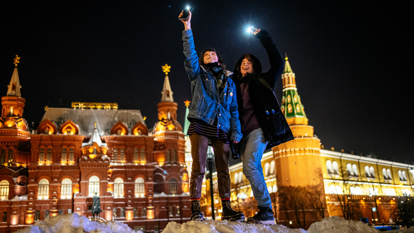 Navalny Supporters Stage Flashlight Protests, in Photos