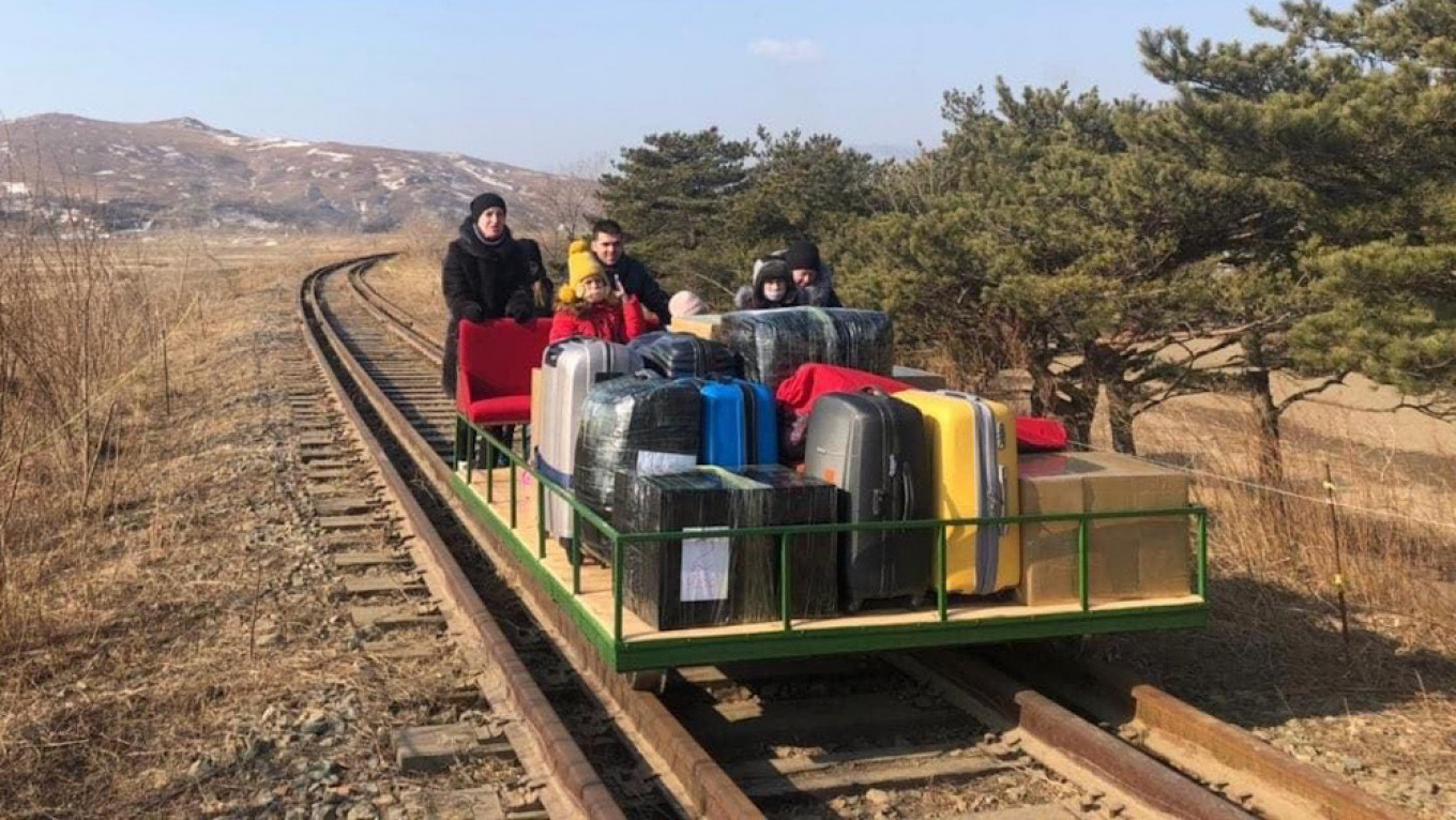 Russian Diplomats Push Railway Handcar Home from North Korea