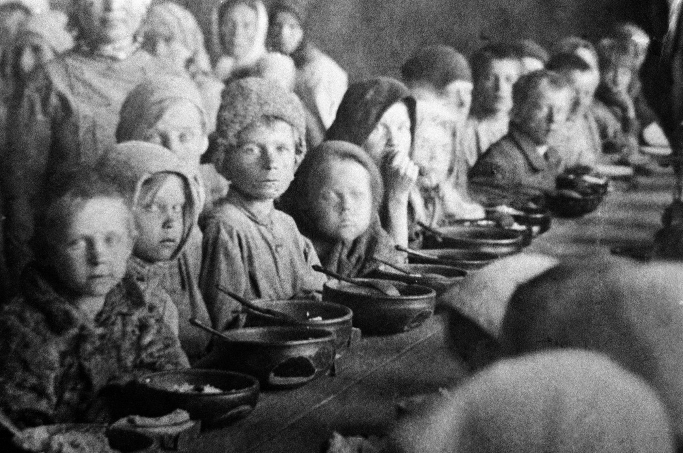  Children eat in a canteen for victims of starvation. Pokrovsk, Saratov province, 1922. TASS 