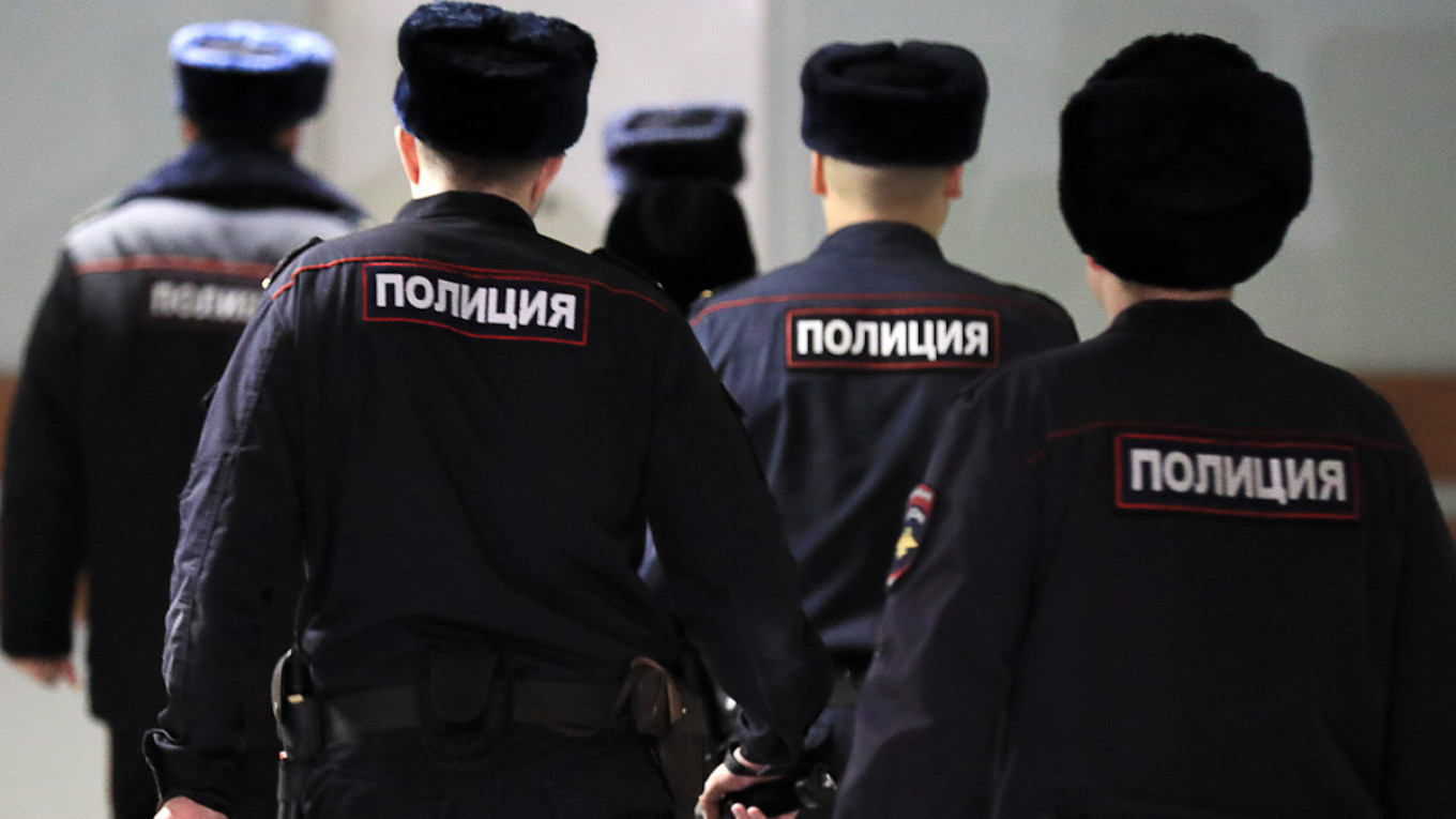 Russian Police Raid Khodorkovsky-Backed Media, Opposition Group