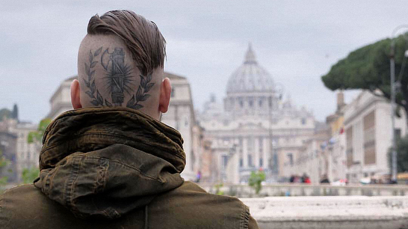 Russian State Media War Reporter Defends Nazi Tattoos