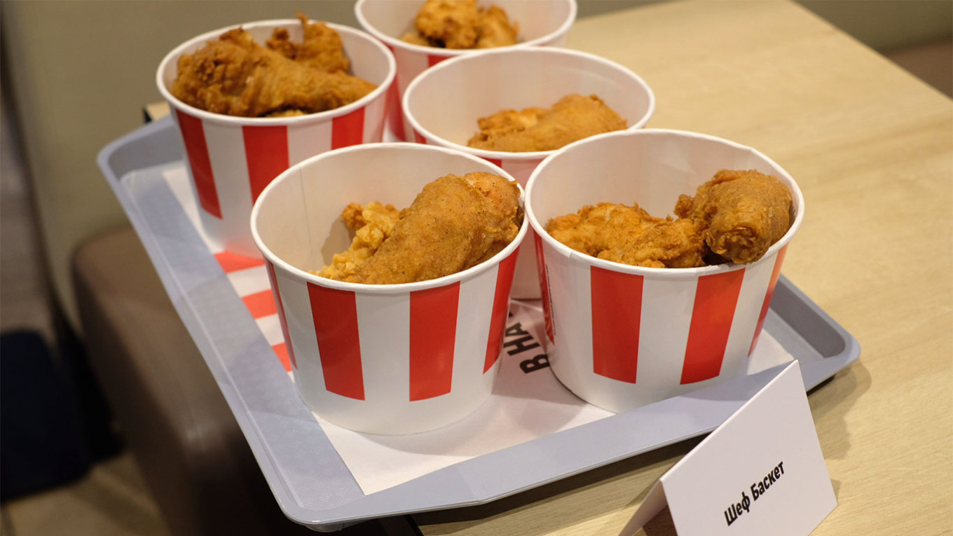  Baskets of chicken bearing the red-and-white colors of KFC's branding. MT 