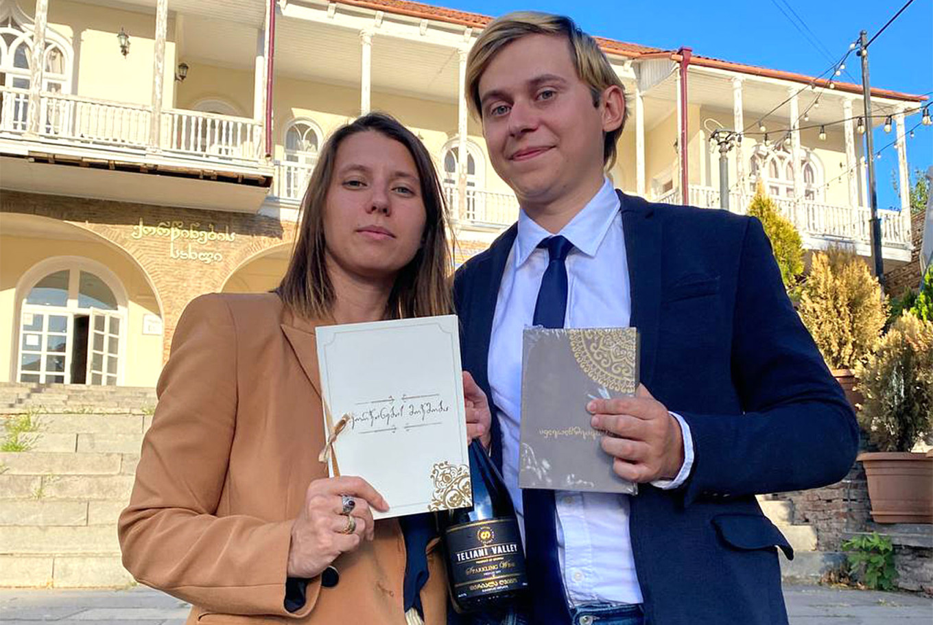  Activist Yekaterina Alexandrova and her husband holding Georgian marriage certificates. Courtesy of Yekaterina Alexandrova 