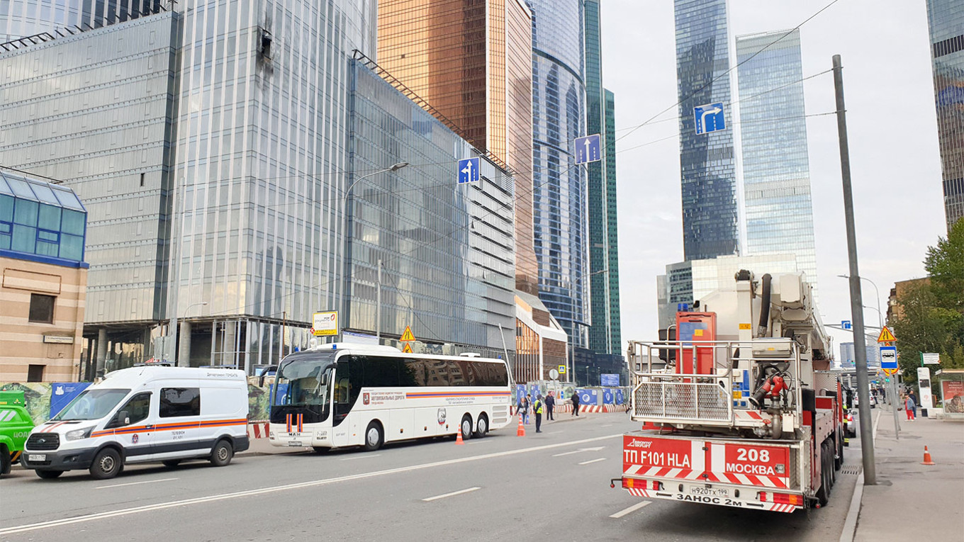  Emergency services at the Moscow City tower, which was hit by a drone on Aug. 23. Moskva News Agency 