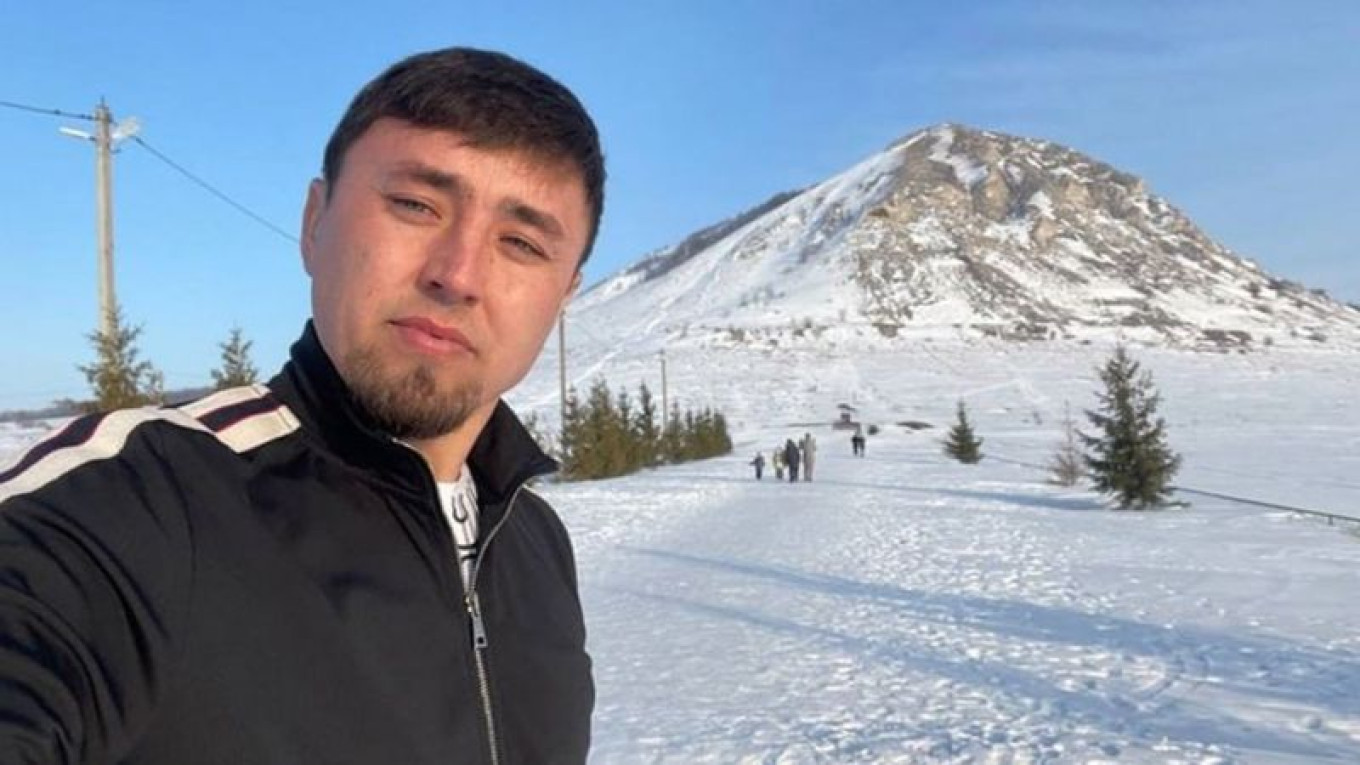  Alsynov in front of one of Bashkortostan's ancient hills, which are considered sacred sites by the Bashkir people. 