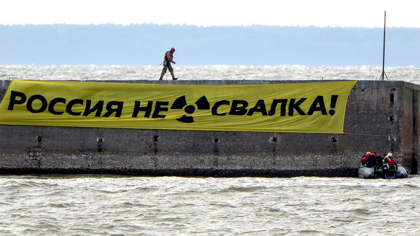  Greenpeace activists unfurl a banner with a message reading "Russia is not a [radioactive waste] dumping ground!" in the port of Ust-Luga on Russia's coast of the Gulf of Finland in 2020. Peter Kovalev / TASS 