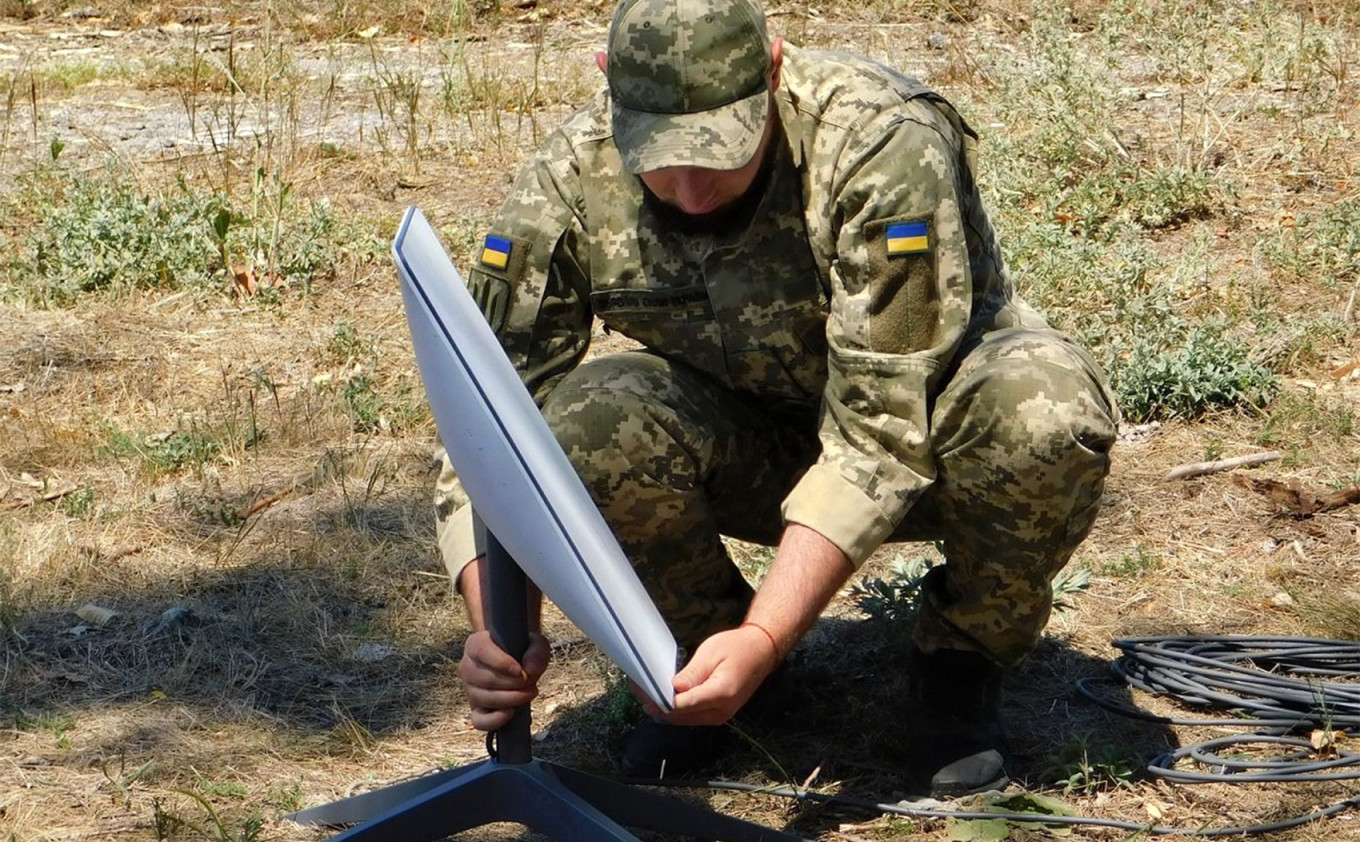  A Ukrainian soldier installing a Starlink terminal. Ukrainian Ministry of Defense 