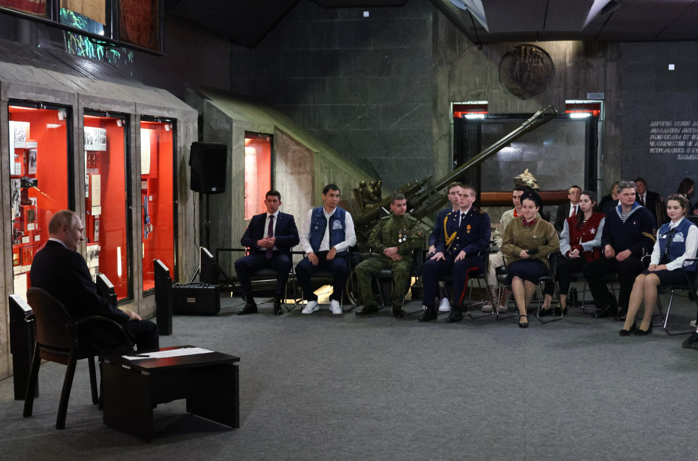  Putin (L) meets with representatives of patriotic and youth organizations at the Battle of Stalingrad Panorama Museum, February 2023. Mikhail Klimentyev / Russian Presidential Press and Information Office / TASS 