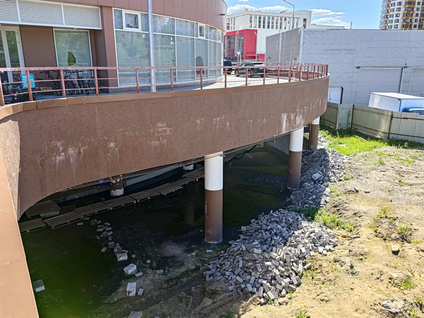  Sewage effluents beneath the Mayak high-rise tower. Moscow Times Reporter 